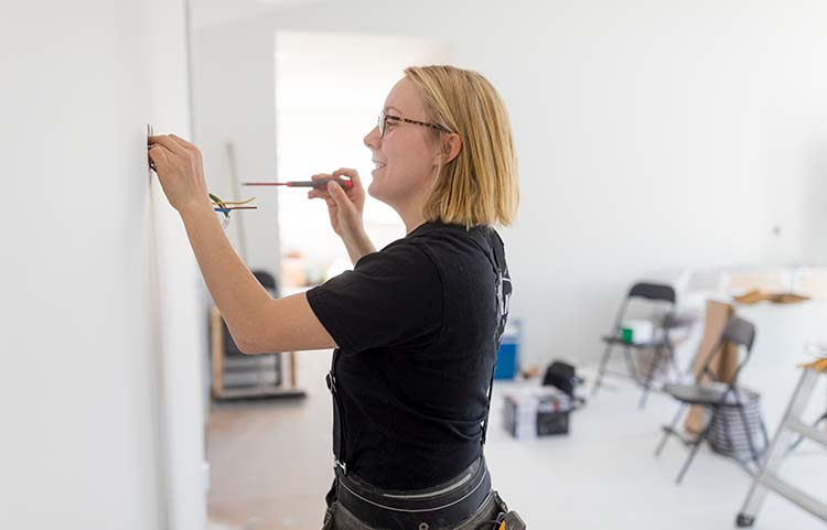 Woman fixing up home.